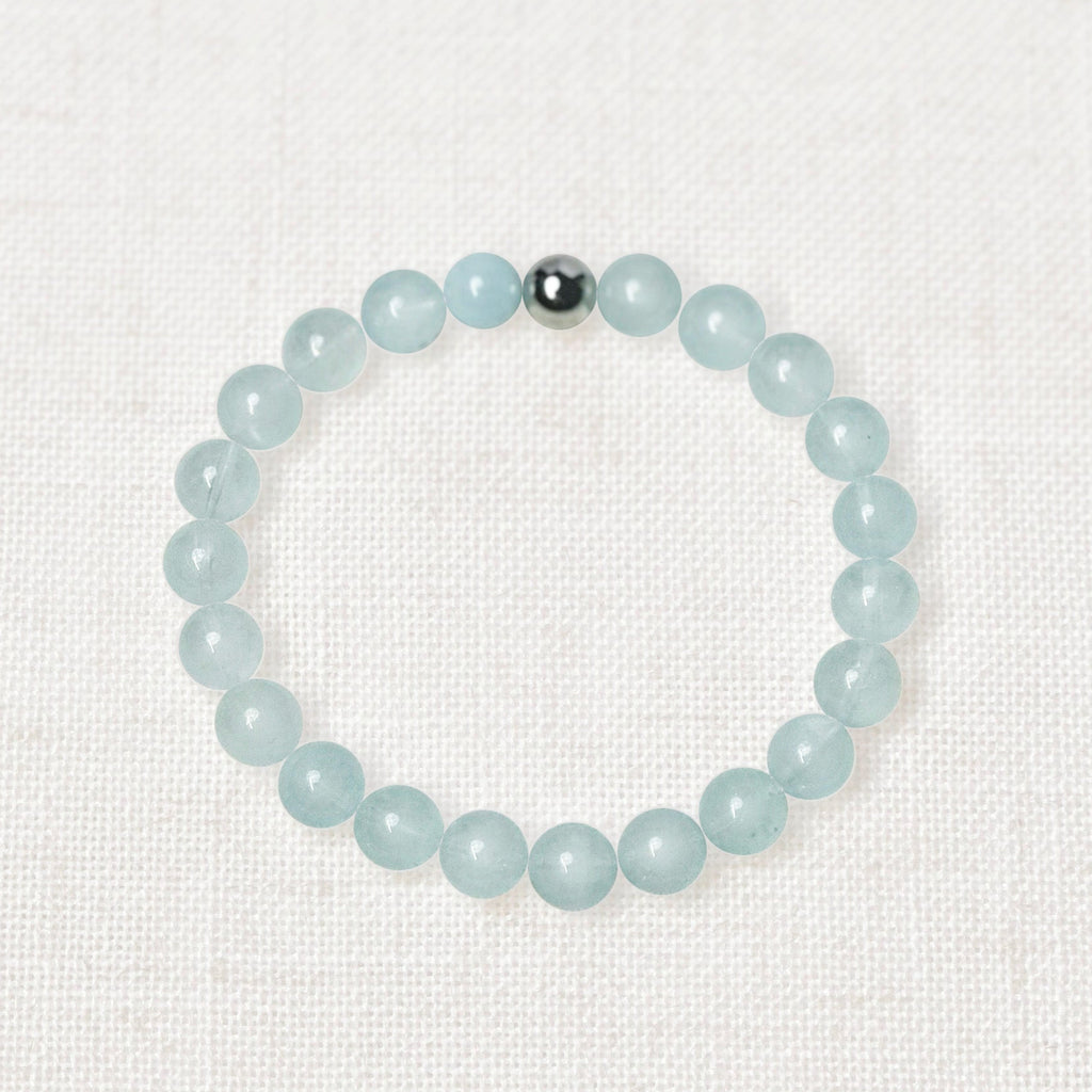 Aquamarine bracelet with 8mm natural beads and silver charm accent