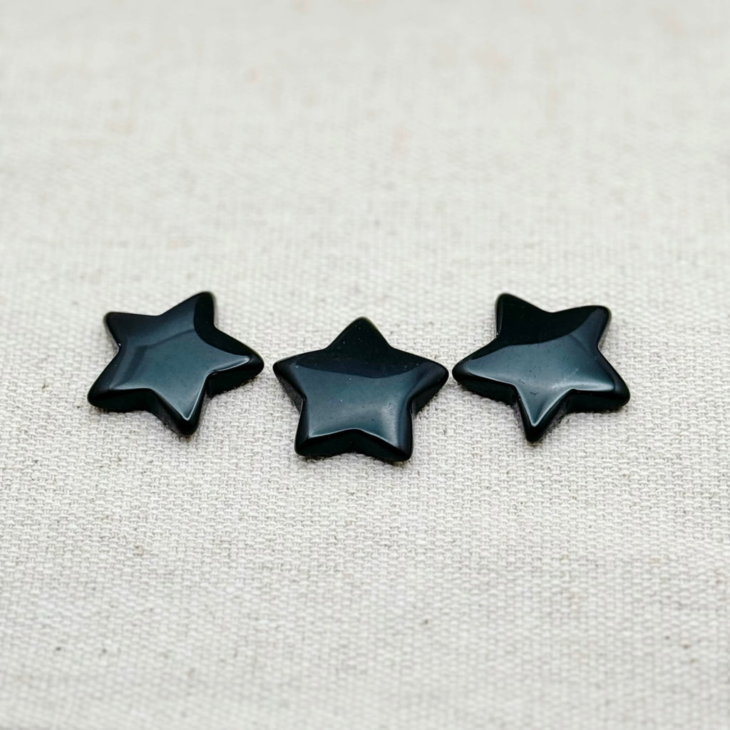 Mini star-shaped Black Obsidian worry stone for protection, grounding, and emotional balance.