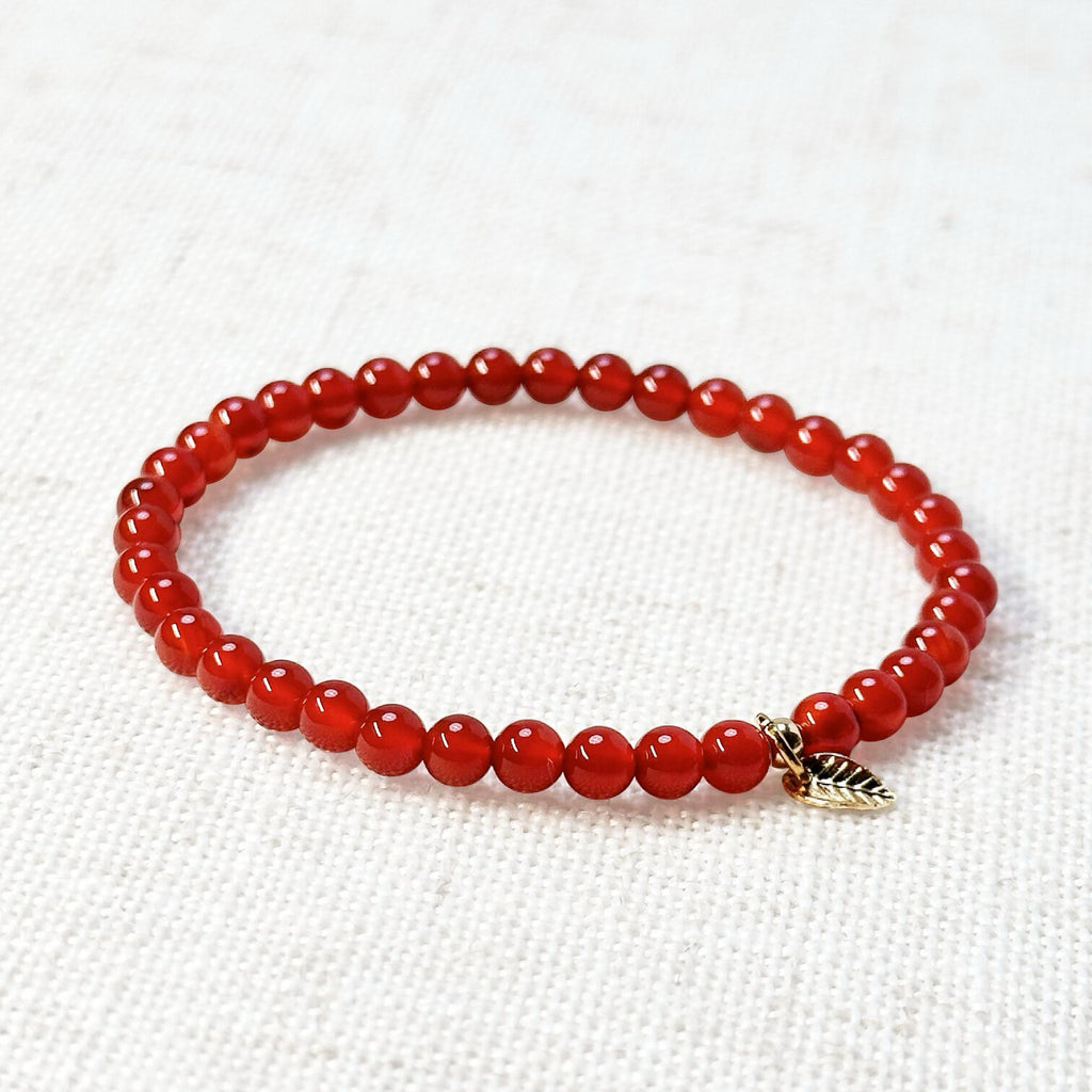 Carnelian bracelet with 4mm vibrant orange-red beads and golden leaf charm
