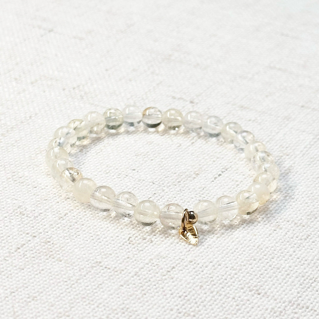 Citrine bracelet with 6mm golden-yellow beads and golden leaf charm