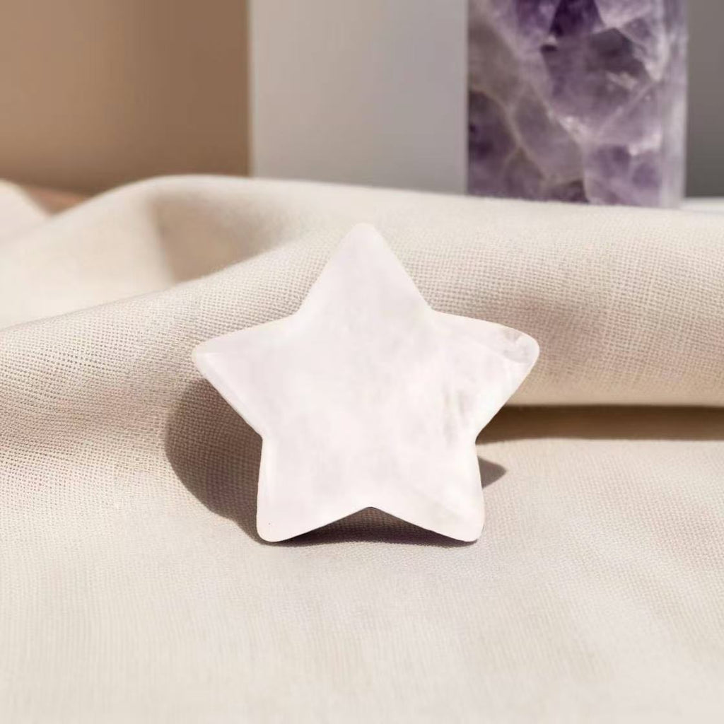 Star-shaped Clear Quartz worry stone for clarity, stress relief, and positive energy.