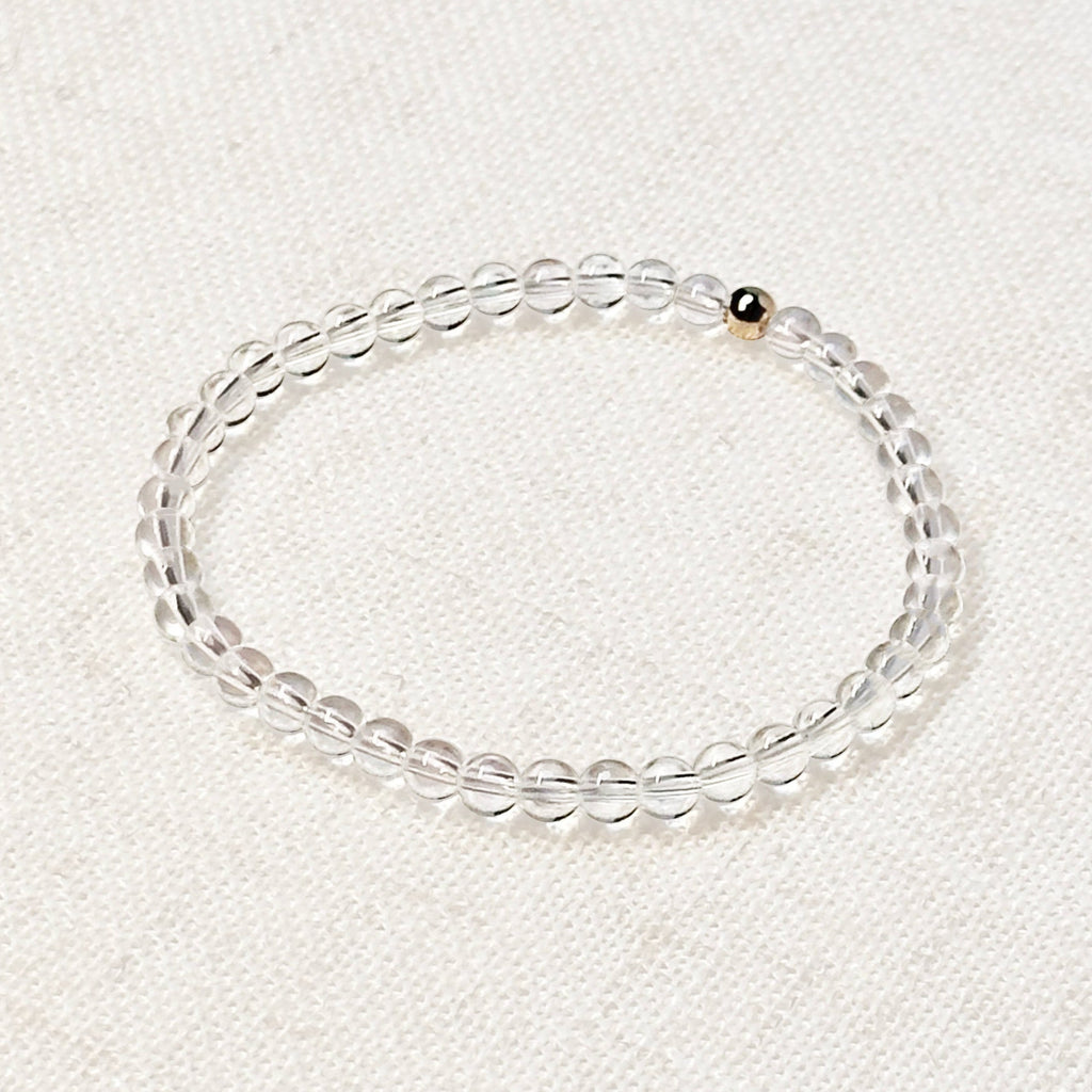 Minimalist clear quartz bracelet styled for clarity and energy