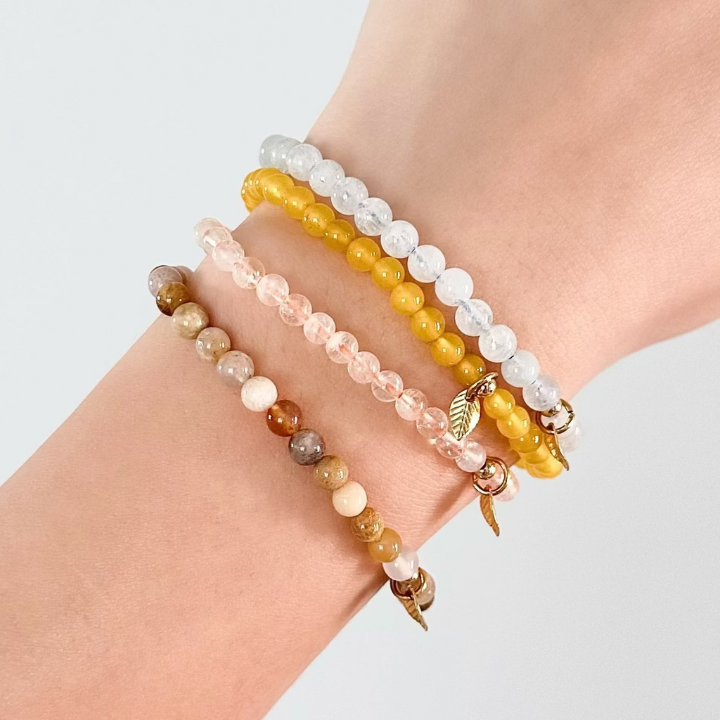 Natural gemstone Gemini bracelet set on soft-toned background