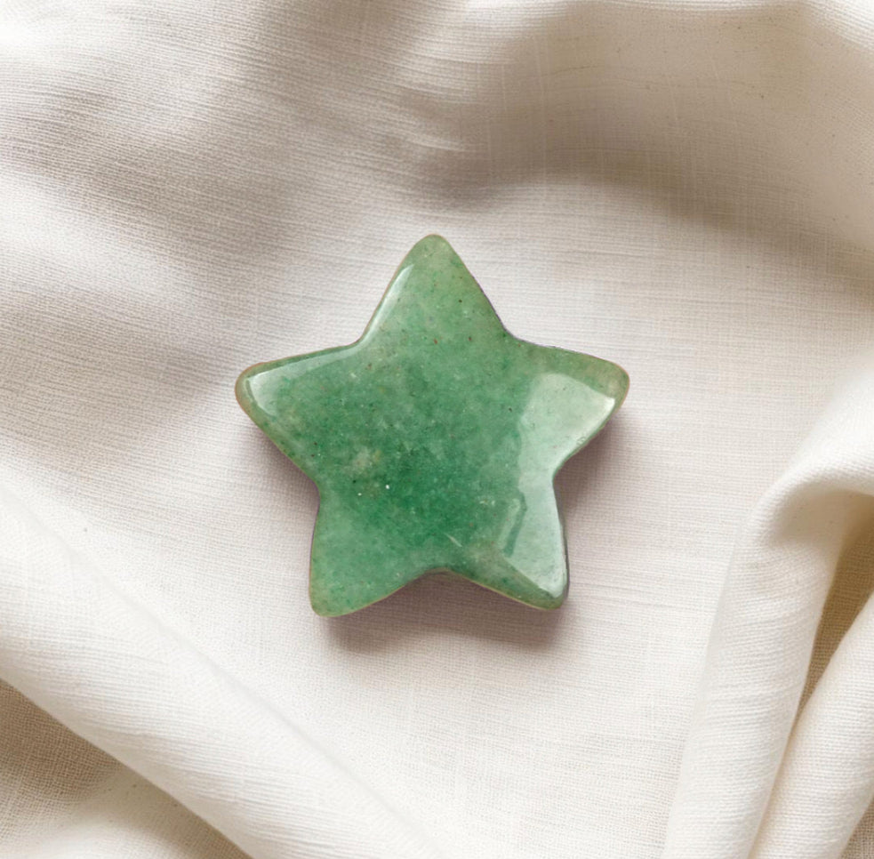 Polished Green Aventurine crystal worry stone in a star shape, promoting confidence, prosperity, and positivity.