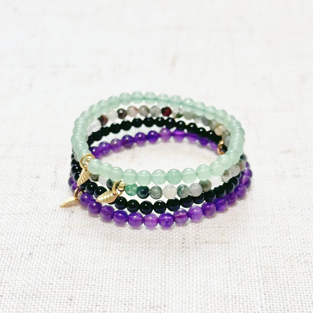 Health & Vitality crystal bracelet set with Amethyst, Bloodstone, Green Aventurine, and Black Onyx.