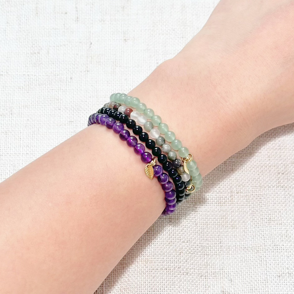 Close-up of healing crystal bracelets designed to boost energy, immunity, and emotional balance.