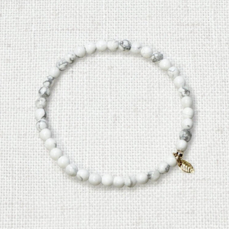 Howlite bracelet with 4mm calming white beads and golden leaf charm