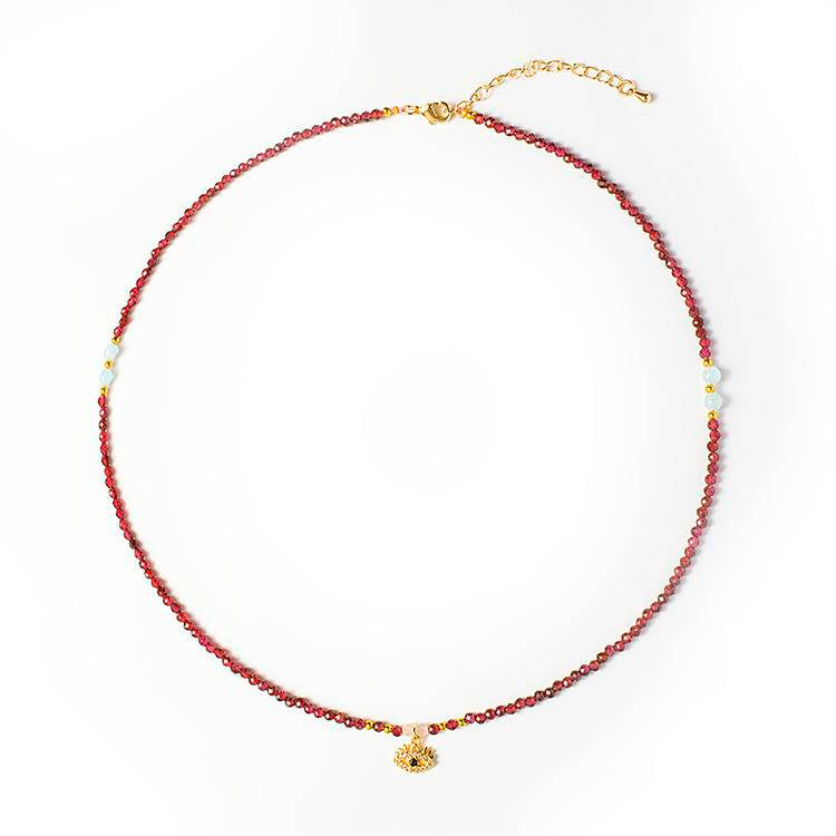 Elegant garnet necklace with evil eye pendant, a protective birthstone necklace for January.