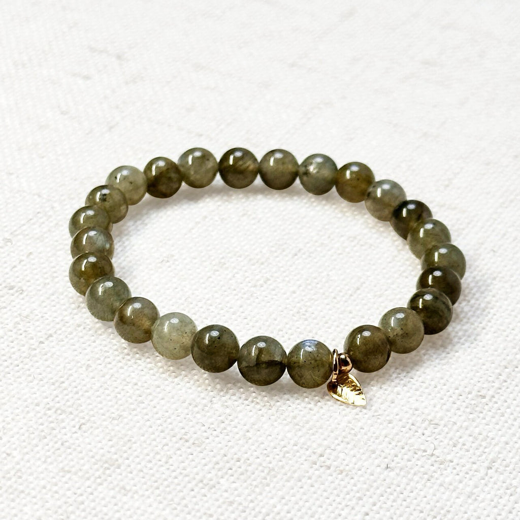 Close-up of 3A labradorite bracelet showing iridescent flash and gold accent
