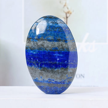 Lapis lazuli palm stone crafted with shimmering crystal, ideal for Libra and Taurus zodiac signs