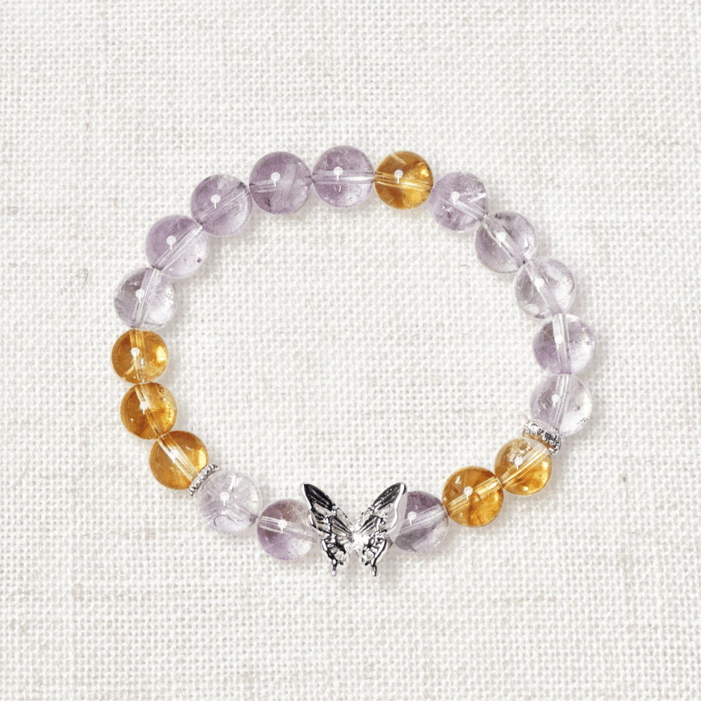 Lavender Amethyst Bracelet - Butterfly’s Dream: A delicate and enchanting bracelet featuring soft purple lavender amethyst beads, accented with a graceful silver butterfly charm. Symbolizing transformation, serenity, and inner peace, this elegant piece embodies a dreamy and mystical charm.