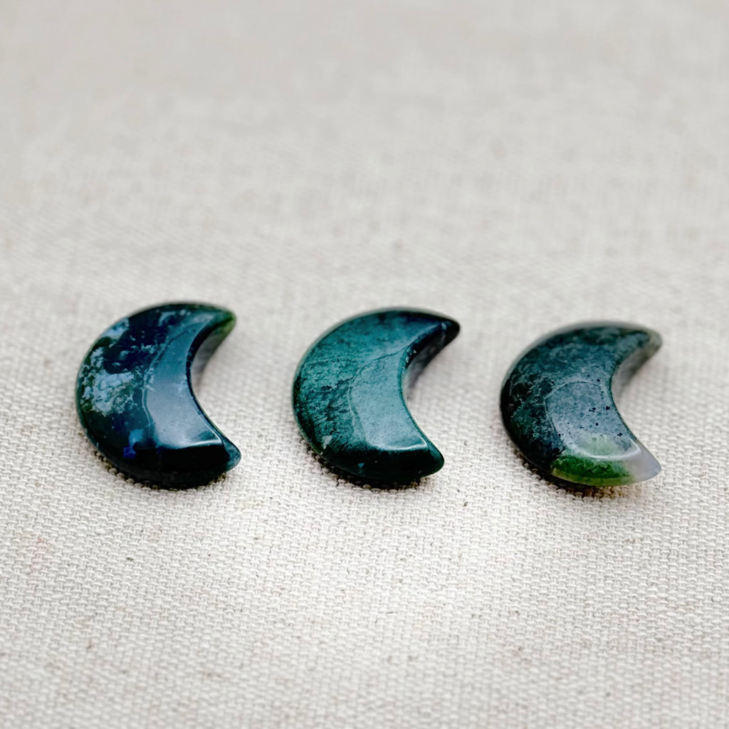 Mini moon-shaped Water Moss Agate worry stone for balance, emotional healing, and grounding energy.