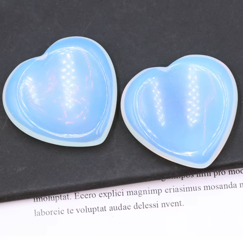 Polished Opal crystal worry stone in a heart shape, promoting joy, confidence, and relaxation.
