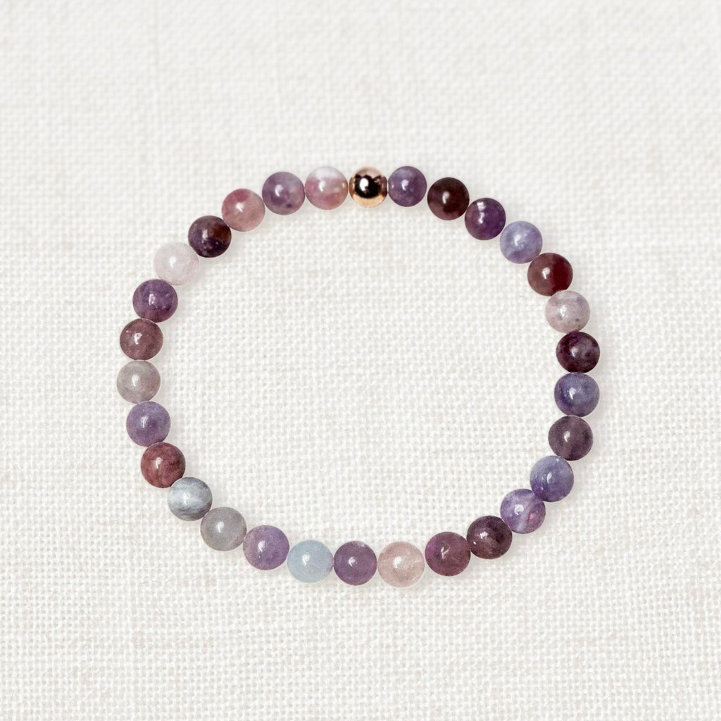 Plum blossom tourmaline bracelet with 6mm beads and gold charm for emotional balance