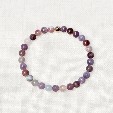 Plum blossom tourmaline bracelet with 6mm beads and gold charm for emotional balance
