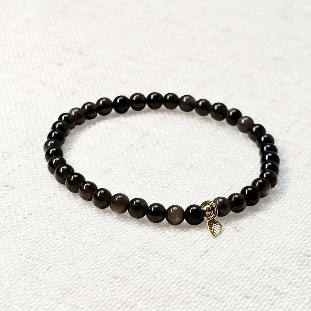 Silver obsidian bracelet with 4mm beads and golden leaf charm for protection and clarity
