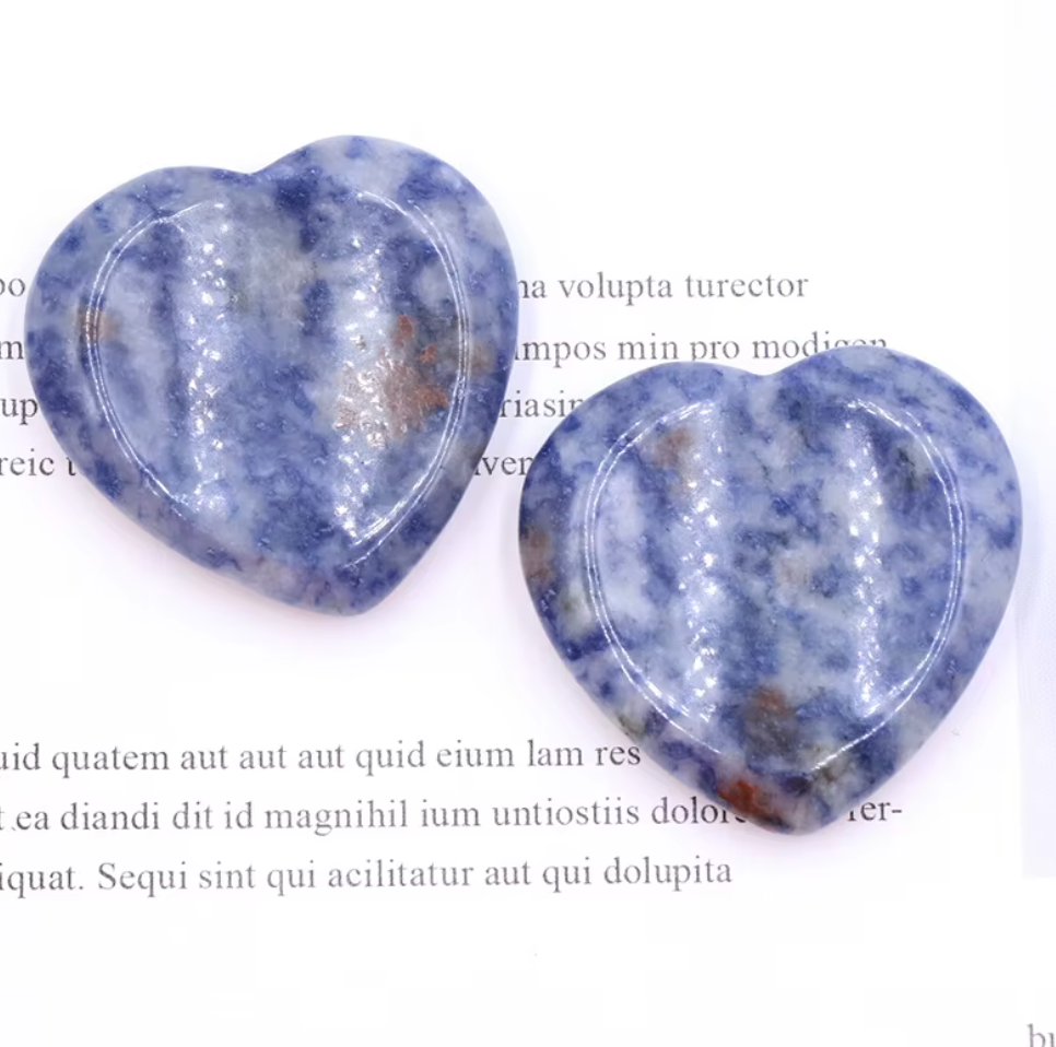 Polished Sodalite crystal worry stone in a heart shape, promoting clarity, inner peace, and relaxation.