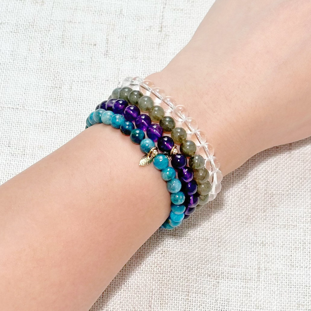 Close-up of gemstone bracelets designed to enhance intuition and connect with higher consciousness.