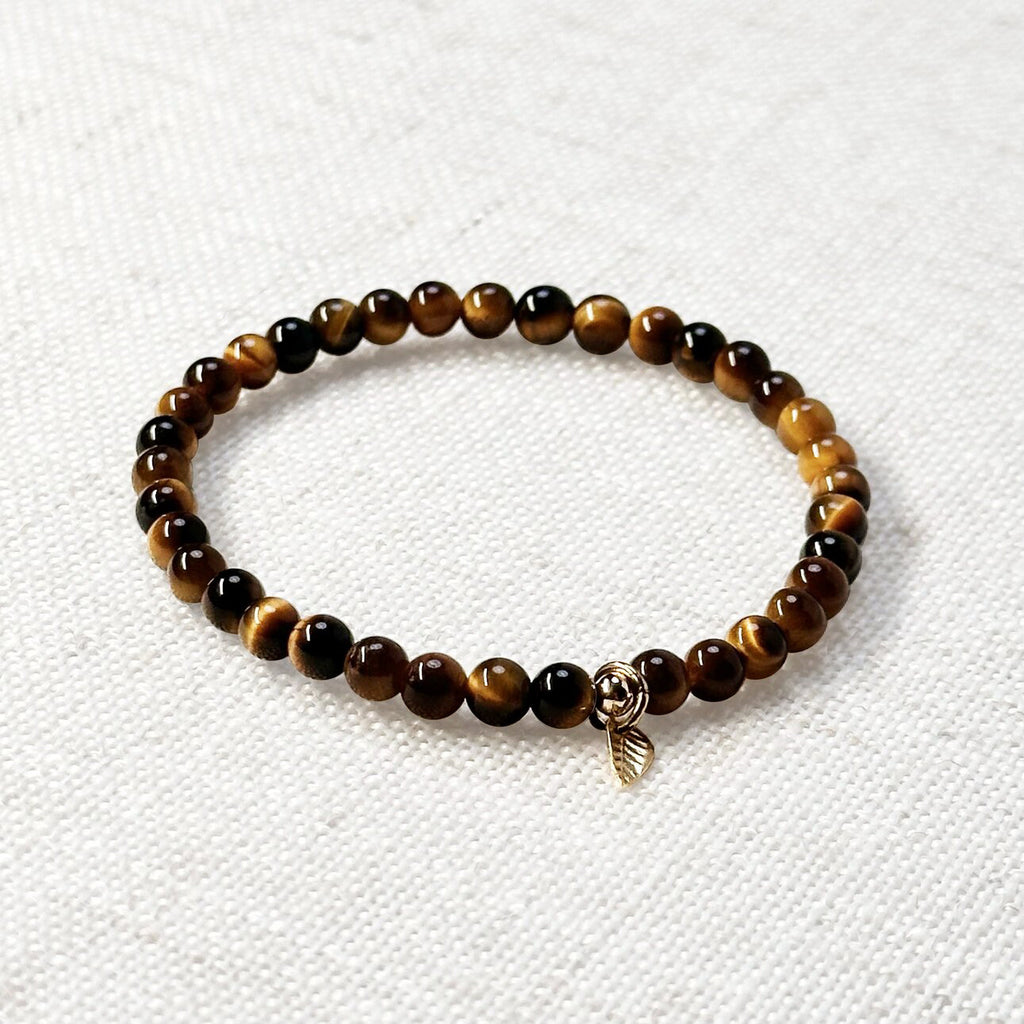 Close-up of 5A yellow tiger’s eye bracelet with golden leaf charm – 4mm beaded gemstone jewelry.