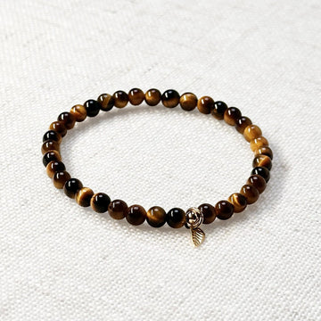 Close-up of 5A yellow tiger’s eye bracelet with golden leaf charm – 4mm beaded gemstone jewelry.