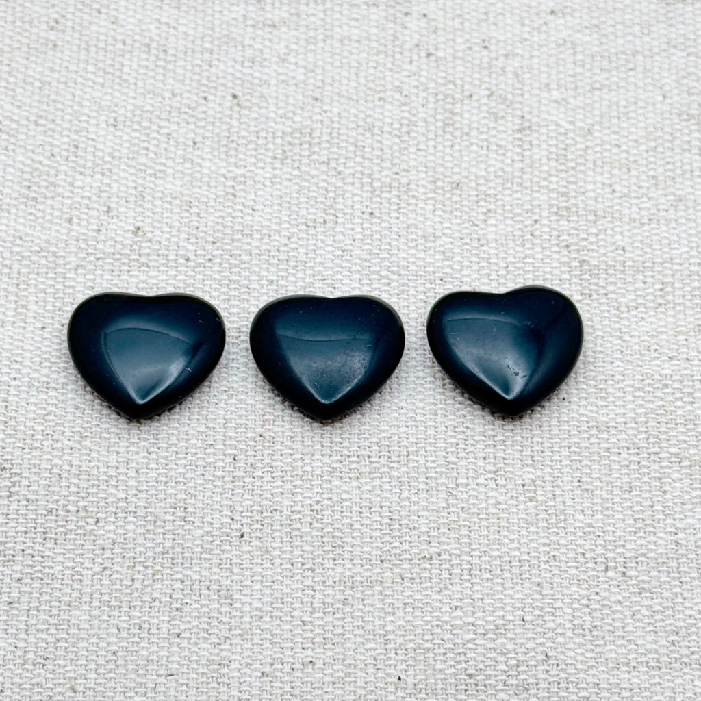 Mini heart-shaped Black Obsidian worry stone for protection, grounding, and emotional balance.