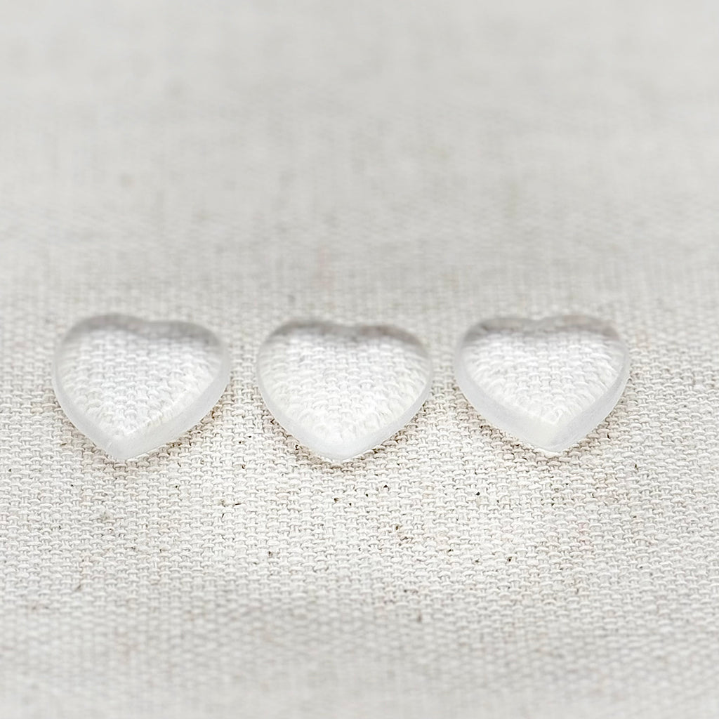 Clear Quartz worry stone in a mini heart shape, symbolizing clarity, healing, and positive energy