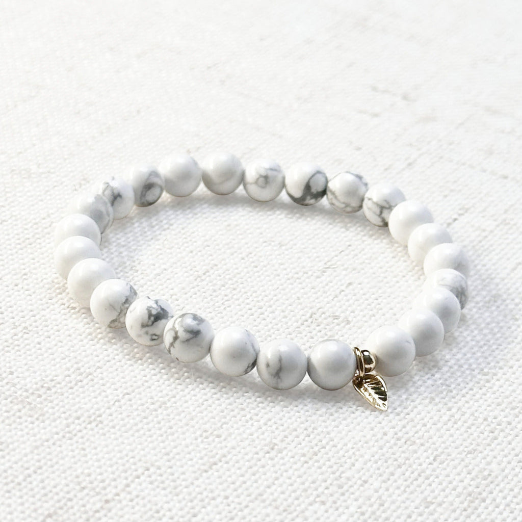 White howlite bracelet with 6mm beads and golden leaf charm