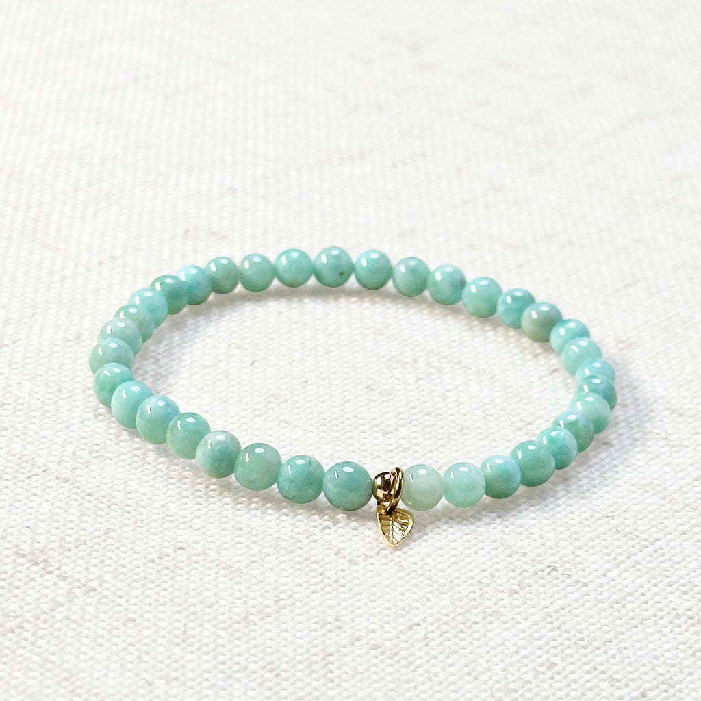 4mm larimar bracelet styled with soft tones and spiritual accessories