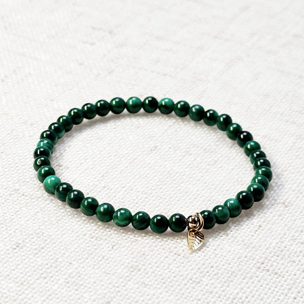 Close-up of malachite stone bracelet for heart chakra and transformation