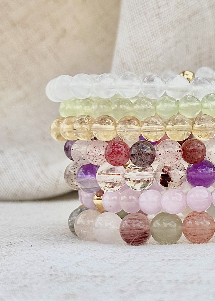 Stacked healing crystal bracelets made with natural stones for daily rituals.